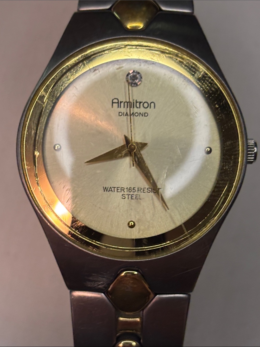 Armitron Gold and Silver Round Dial Bracelet Watch